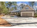 Beautifully landscaped home with a long driveway, attached garage, and plenty of trees at 5171 A Meadowlark Trl, Sanford, NC 27332