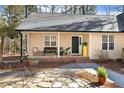 Welcoming front porch with comfortable seating, potted plants, and attractive stone pathway at 5171 A Meadowlark Trl, Sanford, NC 27332