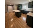 Spacious kitchen featuring an island, modern appliances, and ample cabinet space at 1017 Bailes Dr, Sanford, NC 27330