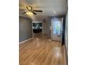 Open-concept living space with hardwood floors, flowing seamlessly into the kitchen at 1017 Bailes Dr, Sanford, NC 27330