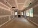 Bright living room with fireplace showcasing large windows and great natural light at 188 Landon Rdg, Sanford, NC 27330