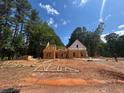 New home under construction with trees in background and blue sky at 194 Landon Rdg, Sanford, NC 27330