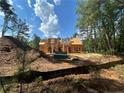 New home under construction with blue sky and trees in background at 194 Landon Rdg, Sanford, NC 27330