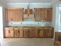 Spacious kitchen area ready for appliances and featuring wood cabinets at 194 Landon Rdg, Sanford, NC 27330