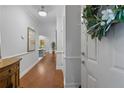 Spacious hallway with hardwood floors and high ceilings, connecting to the rest of the home at 310 Gallery Dr # 201, Spring Lake, NC 28390