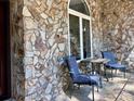 Cozy front porch with stone facade, quaint seating, and pleasant outdoor ambiance at 39 Tahoe Cir, Sanford, NC 27332
