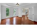 Elegant dining room featuring hardwood floors, paneled walls, and natural light at 569 Yorkshire Dr, Cameron, NC 28326