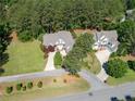 Aerial view of property showcasing well-manicured lawns and mature trees at 631 Anderson Creek Dr, Spring Lake, NC 28390