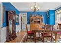 This formal dining room features hardwood floors and lovely natural light at 631 Anderson Creek Dr, Spring Lake, NC 28390