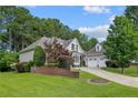 This home features a beautiful lawn and mature landscaping, offering great curb appeal at 631 Anderson Creek Dr, Spring Lake, NC 28390