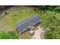 Aerial view showcasing a single story home with a dark gray roof and expansive lot at 171 Waters Way, Lillington, NC 27546
