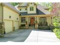 A beautiful home boasting a welcoming front porch, attached garage, and neutral color scheme at 20017 Bragg, Chapel Hill, NC 27517