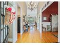 Welcoming foyer with hardwood floors and an open view into the living room at 42 Skipping Water Dr, Spring Lake, NC 28390