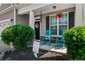 Inviting front porch with rocking chairs and a welcoming atmosphere at 123 Tun Tavern Dr, Cameron, NC 28326