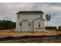 Rear view of home featuring vinyl siding and several windows at 206 Uwharrie Way, Sanford, NC 27330