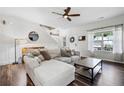 Bright living room featuring a comfortable couch and hardwood floors at 508 Minerva Dale Dr, Fuquay Varina, NC 27526