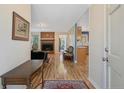 Inviting foyer with hardwood floors, fireplace, and seamless flow into the living spaces at 73 Night Heron Ct, Sanford, NC 27332