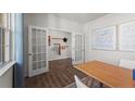 Dining room features French doors and stylish decor at 665 Wilder Bloom Path, Aberdeen, NC 27526