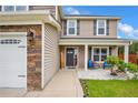 Inviting front porch with rocking chairs, stone accents, and a welcoming entrance at 104 Parkview Ln, Lillington, NC 27546