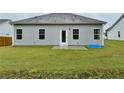 Back exterior featuring a door to the yard and a blue pool at 4939 Pioneer Dr, Sanford, NC 27330