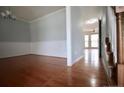 Elegant dining room with hardwood floors and chair rail detail flows into an open floor plan at 70 Ramsey Ct, Cameron, NC 28326