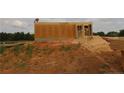 View of partially constructed home showing plywood exterior walls under construction at 214 Uwharrie Way, Sanford, NC 27330