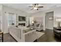 Bright living room with hardwood flooring, fireplace, and comfortable seating at 25 Glenside Ct, Spring Lake, NC 28390