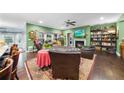Spacious living room with fireplace, hardwood floors, and many windows for natural light at 2817 Oxford Bluff Dr, Wake Forest, NC 27587