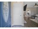 View from entryway showing white interior door and open floorplan at 58 Harvest Ct, Linden, NC 28356