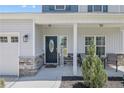 Charming front porch with decorative columns and stone accents at 58 Harvest Ct, Linden, NC 28356
