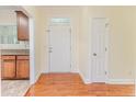 Bright entry foyer showcasing hardwood flooring and a traditional white door at 1536 Louisiana Ln, Sanford, NC 27332