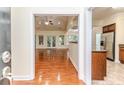 Spacious living room features hardwood floors, recessed lighting, and backyard access at 1536 Louisiana Ln, Sanford, NC 27332
