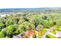 Gorgeous aerial shot of the community, displaying the homes surrounded by lush trees, and beautiful landscaping at 225 Lakeview Dr, Sanford, NC 27332