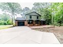 Beautiful single-Gathering home with brick accents, a spacious driveway, and attached garage, creating a welcoming feel at 225 Lakeview Dr, Sanford, NC 27332