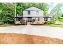 Charming brick home featuring a two-car garage and well-maintained landscaping, offering classic curb appeal at 225 Lakeview Dr, Sanford, NC 27332