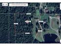 Expansive property showcasing the home's location on a large lot with mature trees and a serene pond at 4085 Alston Bridge Rd, Siler City, NC 27344