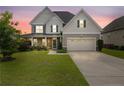 Charming two-story home with stone accents, a covered porch, and a well-maintained lawn at 415 Highgrove Highgrove Dr, Spring Lake, NC 28390
