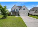 Charming two-story home with stone accents, a covered porch, and a well-maintained lawn at 415 Highgrove Highgrove Dr, Spring Lake, NC 28390