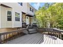 A welcoming entryway featuring a stone facade, covered porch, and a well-maintained deck at 70 Oregon Ln, Spring Lake, NC 28390