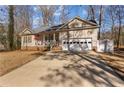 Inviting single-story home with a driveway and an attached two-car garage at 7053 Maple Cir, Sanford, NC 27332