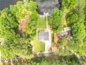 Aerial view of home situated on large lot on lake with private pier at 181 Tree Cutters, Sanford, NC 27332