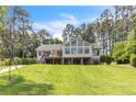 Expansive backyard view featuring a well-maintained lawn and the rear of the home at 181 Tree Cutters, Sanford, NC 27332