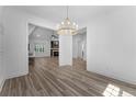 Open-concept living space with lots of natural light, modern decor and hardwood floors at 225 Persimmon Tree Dr, Cameron, NC 28326