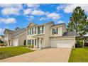 Charming two-story home with landscaped yard, attached garage and mature shade tree at 31 Boston Hbr, Cameron, NC 28326