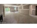 Unfinished living room with fireplace, sliding glass doors, and rough-in electrical at 2 Foxfire Blvd, Cameron, NC 27281