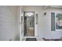 Inviting entryway showcasing light wood flooring and view to the living room at 21 Dinghy Dr, Sanford, NC 27332