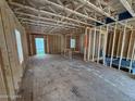 Exposed studs and flooring are visible in this image of the framed home's unfinished interior at 29 Horse Trot Ln, Sanford, NC 27332