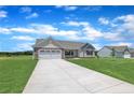 Attractive single-Gathering home features a spacious driveway, green lawn, and classic design elements at 107 Camp Rock Rd, Lillington, NC 27546