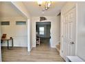 Inviting foyer showcases new luxury vinyl plank flooring and a view into the living spaces at 109 Red Coat Dr, Cameron, NC 28326