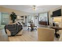 Bright living room boasts modern decor, fireplace, and lots of natural light filtering in through the windows at 159 Gallery Dr # 103, Spring Lake, NC 28390